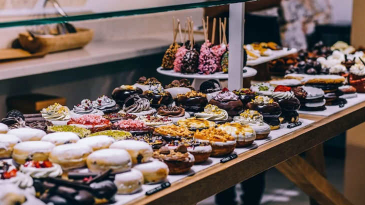 a storefront full of donuts and other baked goods